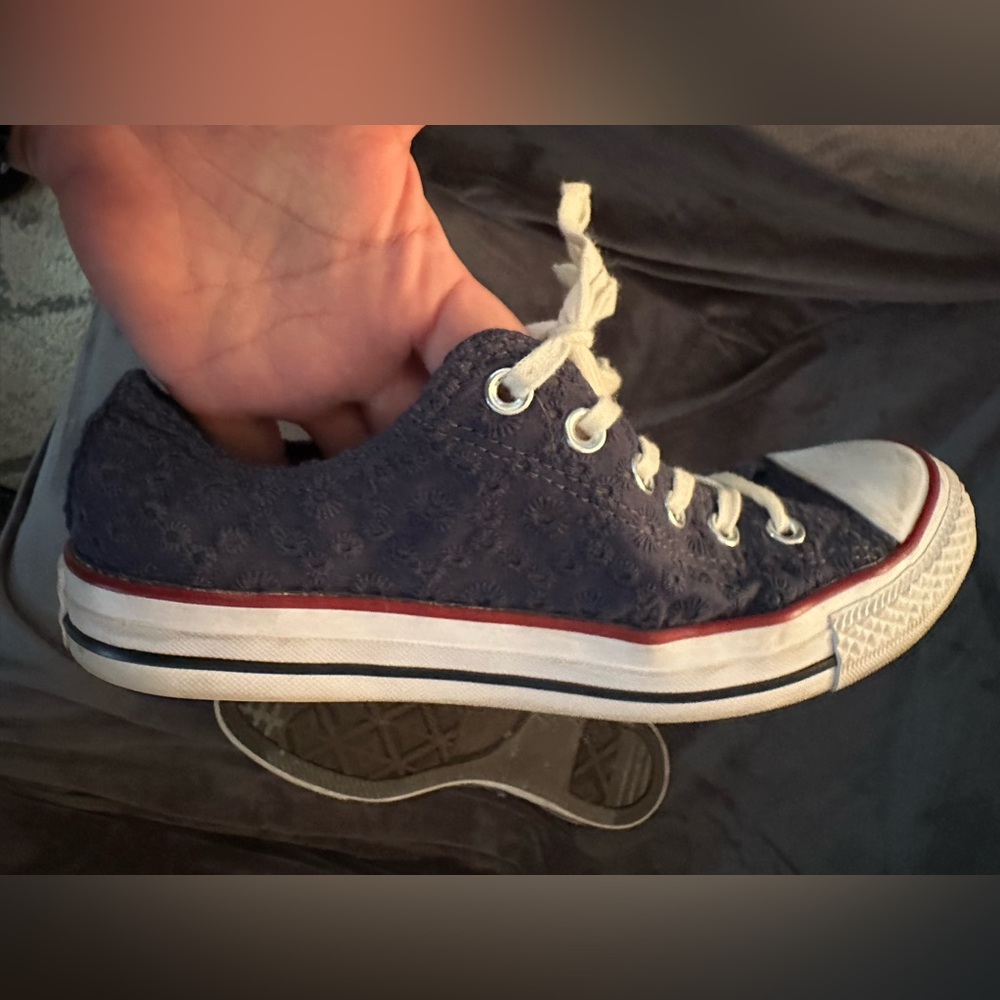 Navy eyelet Converse low top sneakers